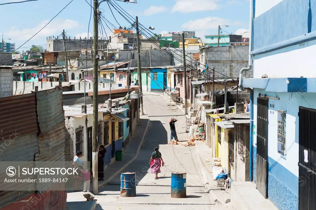 People In The Street With A View Of A Cityscape, Guatemala City Guatemala