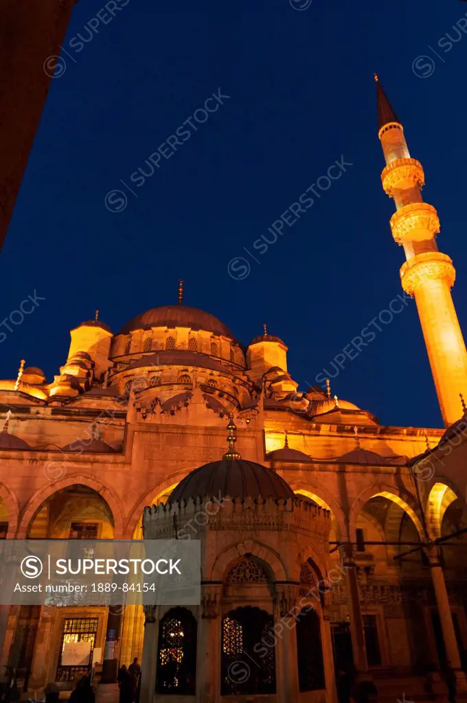 Tower At The Mosque Of The Valide Sultan Illuminated At Night, Istanbul Turkey