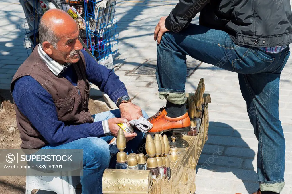 A Man Polishing Shoes On The Street, Istanbul Turkey