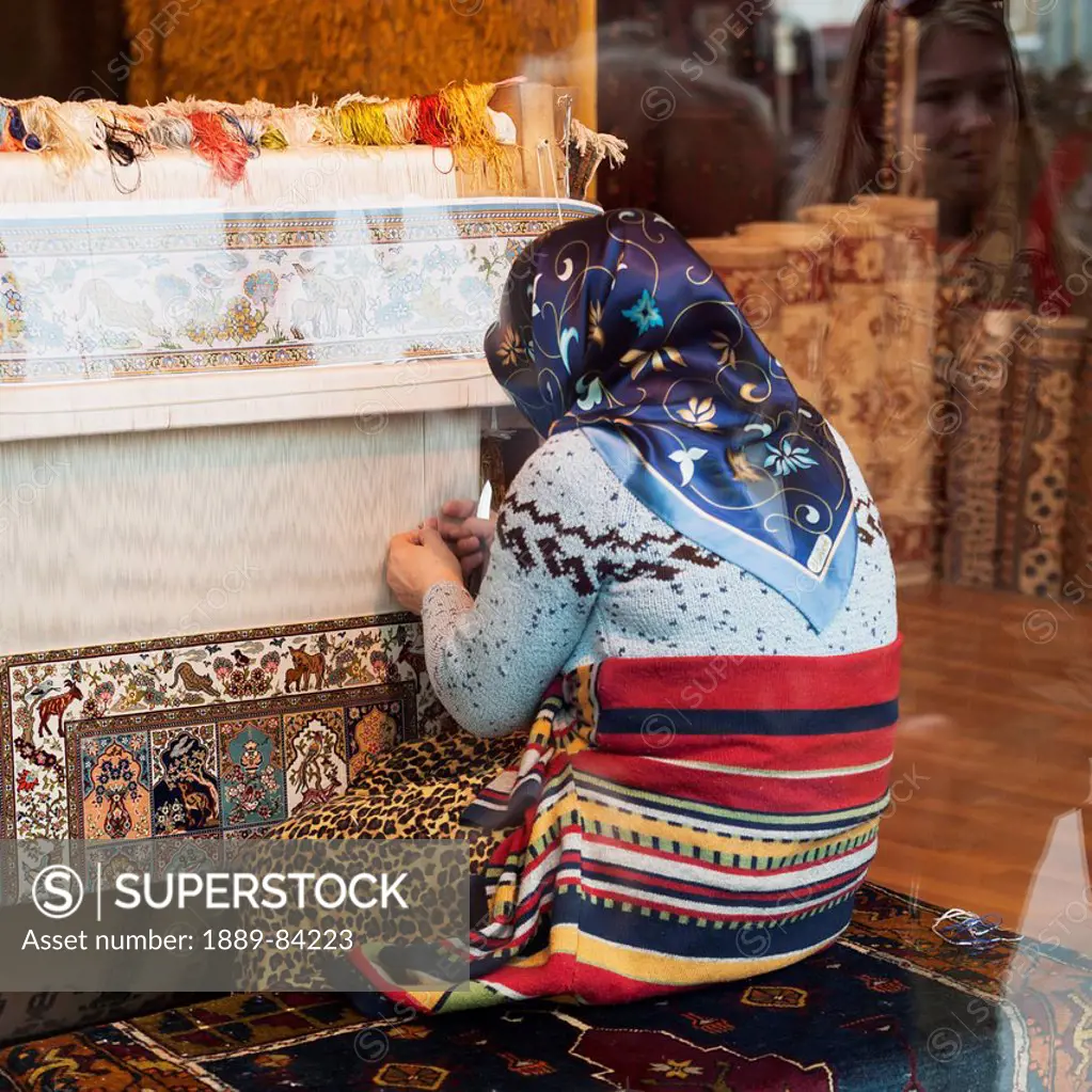 A Woman Kneeling As She Weaves On A Loom, Istanbul Turkey