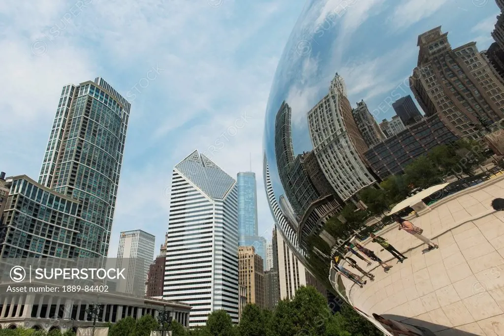 Pedestrians And Buildings Reflected In A Metal Curved Sculpture, Chicago Illinois United States Of America