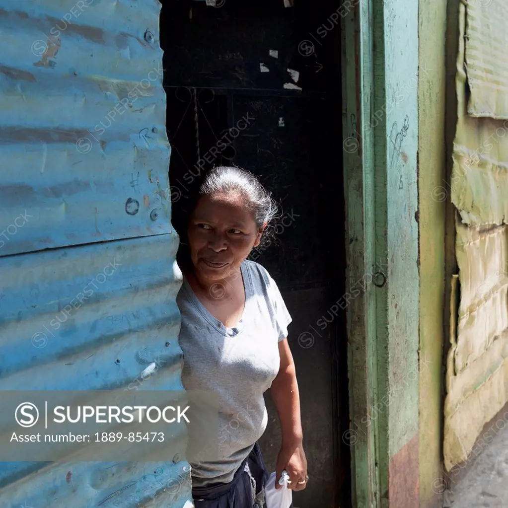 A Woman Standing In A Doorway, Guatemala City Guatemala