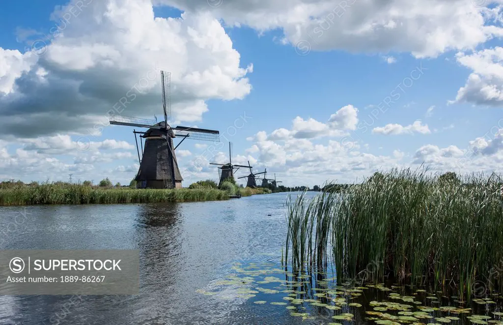 Netherlands, Windmills along water's edge; Kinderjik
