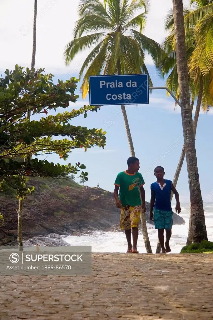 Brazil, Bahia State, Praia Da Costa; Itacare, Two boys walking along beach