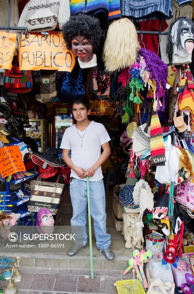 Mexico, Guanajuato State, Portrait Of Boy Standing In Front Of His Souvenir Shop; Guanajuato