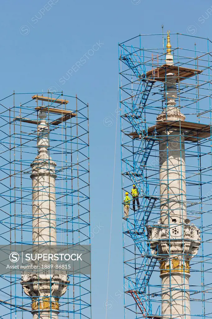 Turkey, Istanbul Province, Two Workers On Scaffolding Surrounding Minarets Of Ortakoy Mosque Which Are Under Renovation; Istanbul