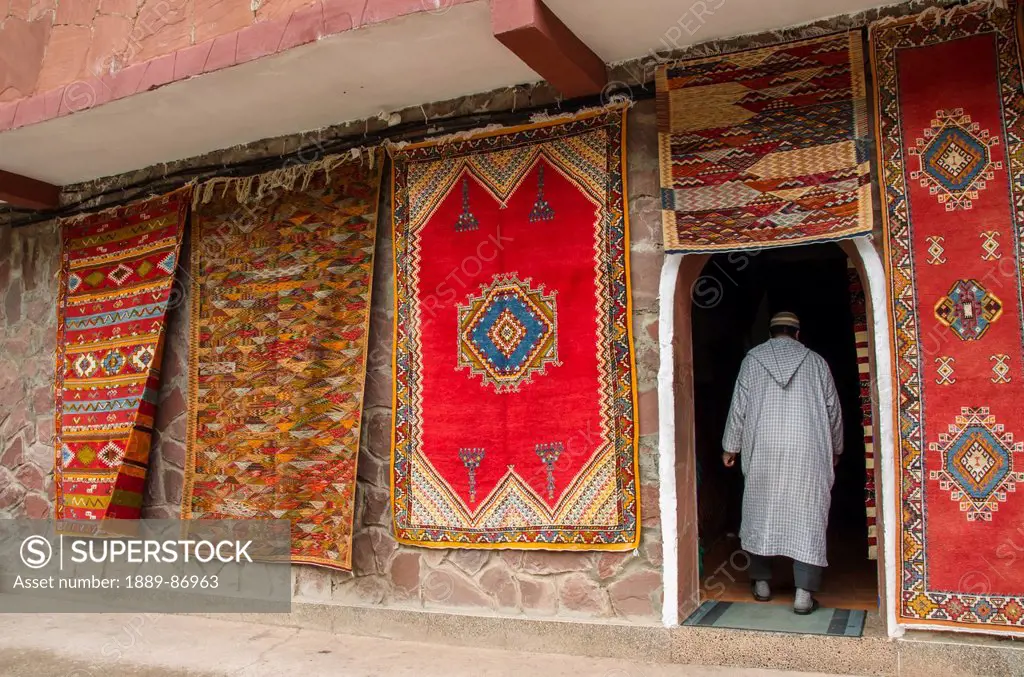 Colorful Rugs Hanging On Display Outside Shop; Morocco