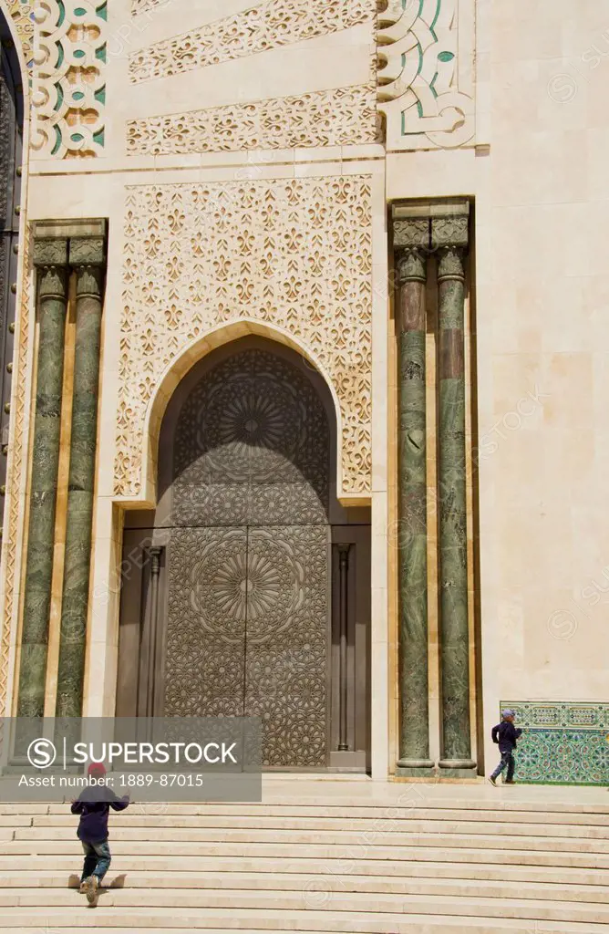 Morocco, Young Boys Jumping Up Steps At Hassan Ii Mosque; Casablanca