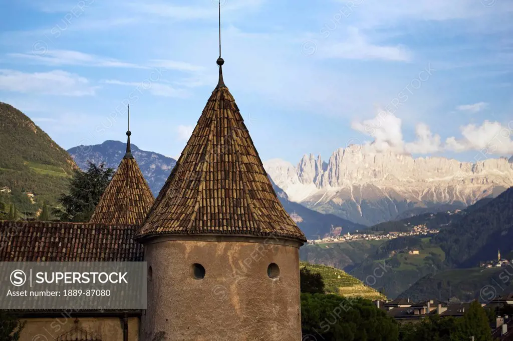 Italy, Alto Adige, Castle Turret With Mountain Range In Background; Bolzano