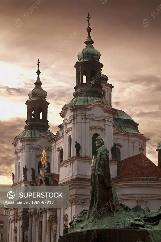 Czech Republic, Architecture And Statue At Sunset; Prague