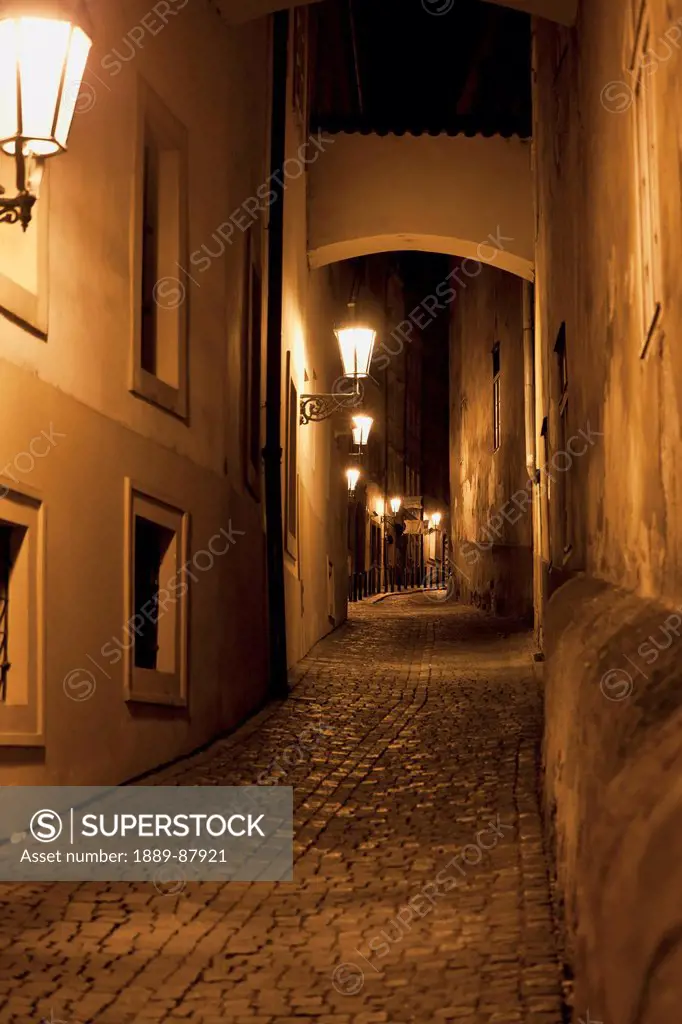 Czech Republic, Alley Illuminated By Lights At Night; Prague