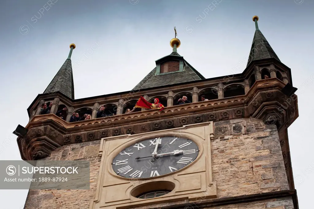 Czech Republic, Low Angle View Of Tourists In Clock Tower; Prague