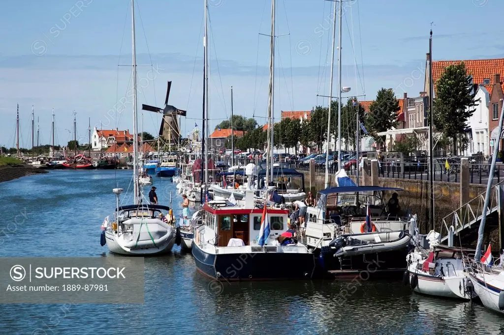 Netherlands, Zealand, Boats In A Busy Harbor Along The Waterfront; Zierikzee