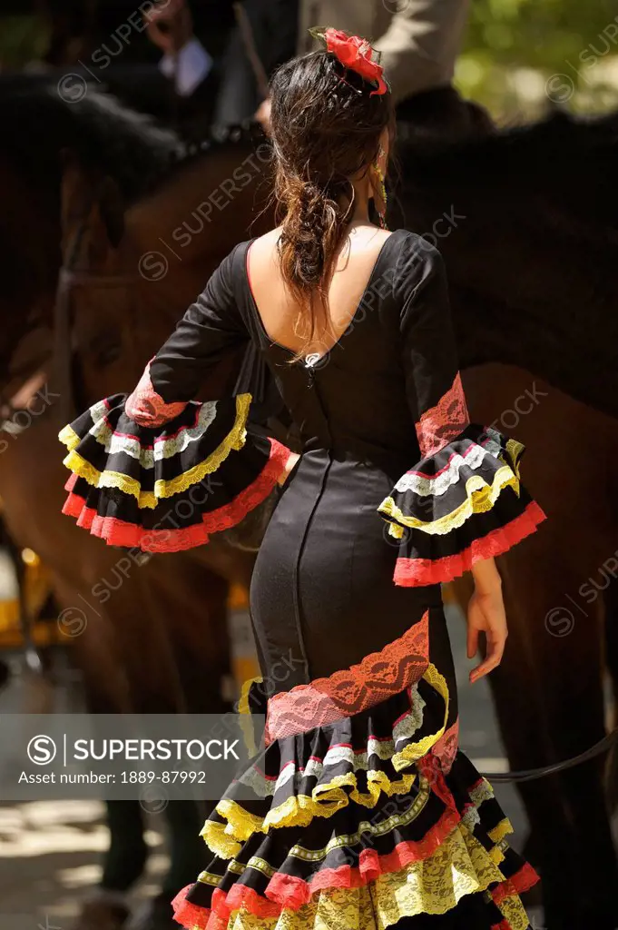Spain, Andalusia, A Woman Dressed In A Costume For The April Fair; Seville
