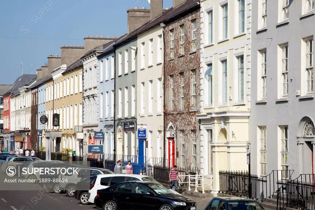 Row houses and parked cars along the street;Tralee county kerry ireland