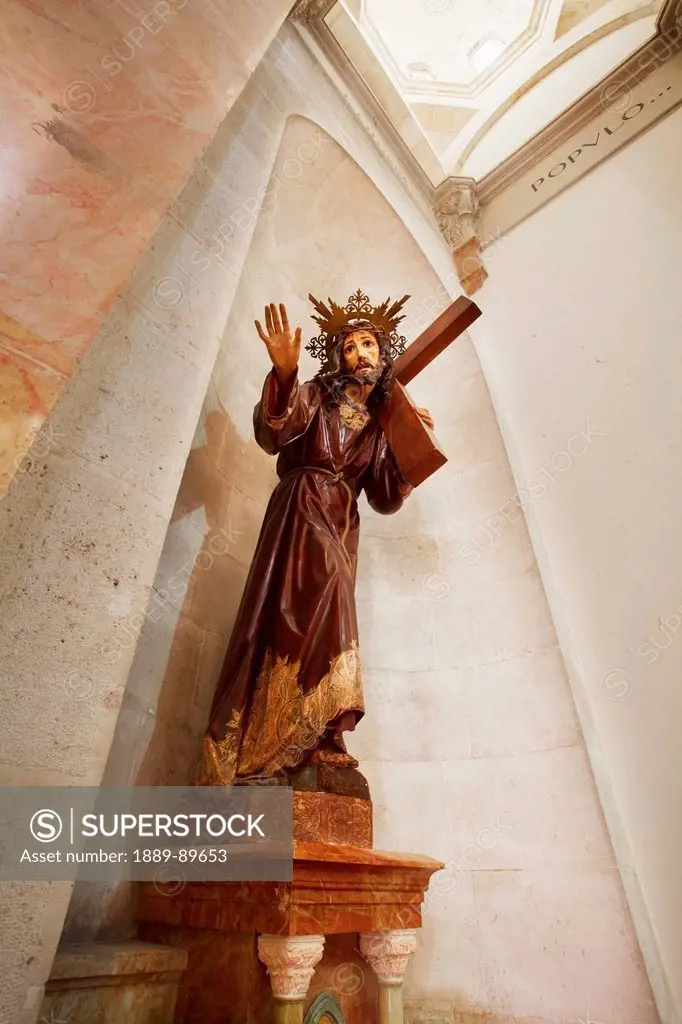 Sculpture of Jesus Christ with cross in Chapel of Condemnation; Jerusalem, Israel