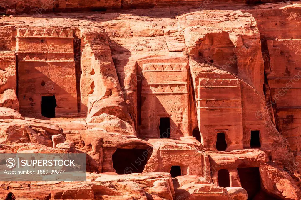 Facades of ancient rock buildings; Petra, Jordan