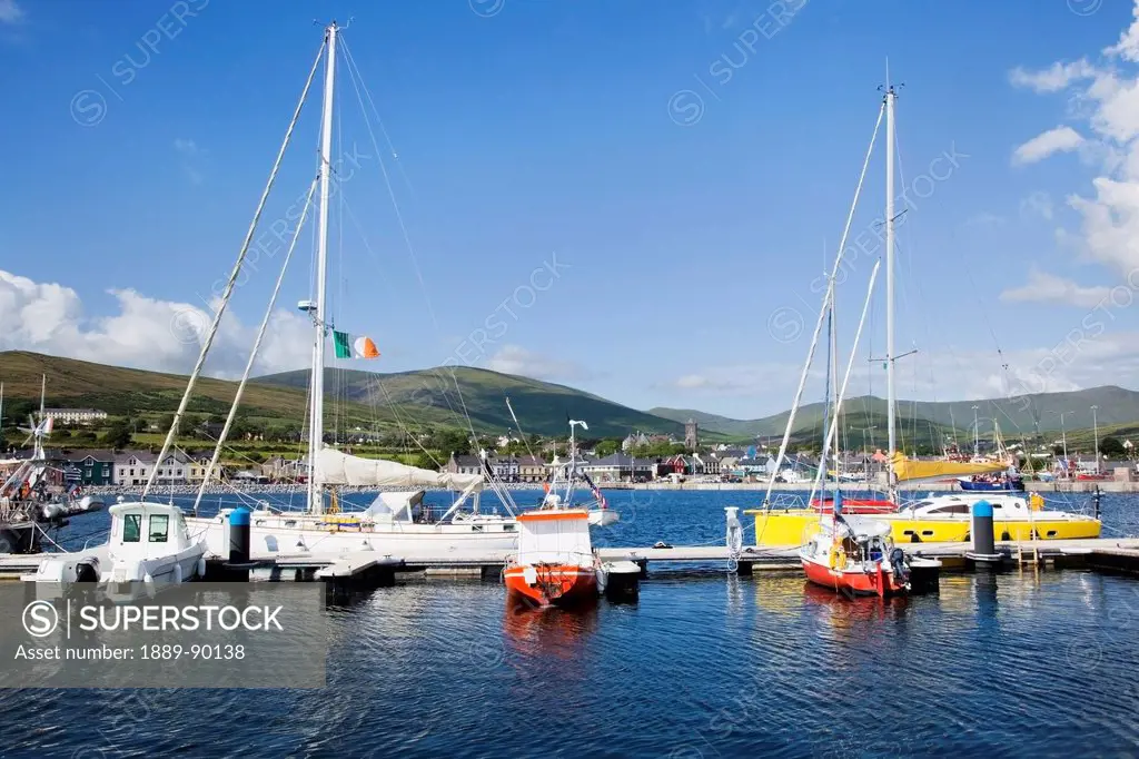 Boats in dingle harbour under a blue sky;Dingle county kerry ireland
