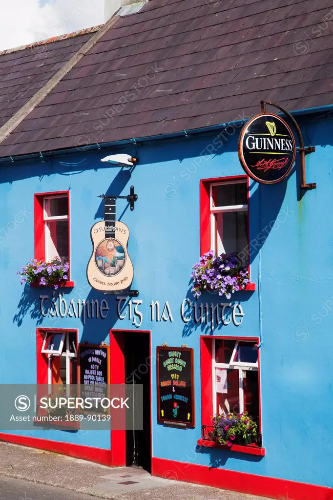 A colourful pub in a blue and red building;Dingle county kerry ireland