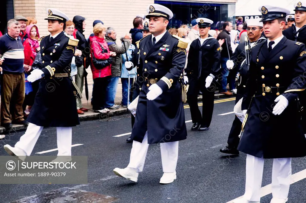 Soldiers marching down the street in the tall ship race parade;Dublin county dublin ireland