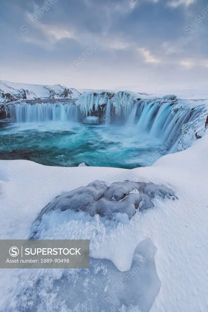 Godafoss with large pieces of ice forming in the cold weather; Iceland