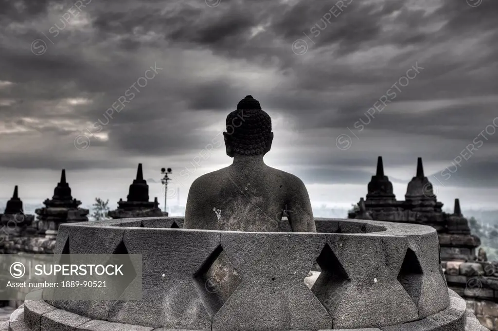 One of the few exposed Buddhas in Borobudur; Yogyakarta, Indonesia