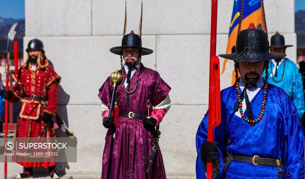 Three guards stand watch during the ceremonial guard change at Gyeongbokgung; Seoul, South Korea