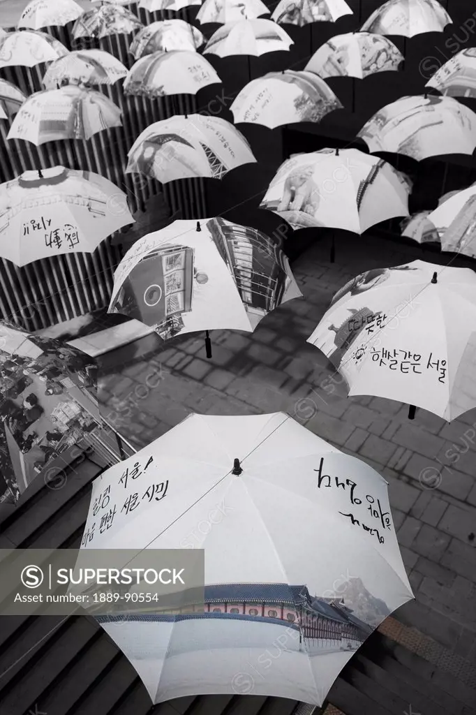 An art installation near the City Hall with many umbrellas dangling above; Seoul, South Korea