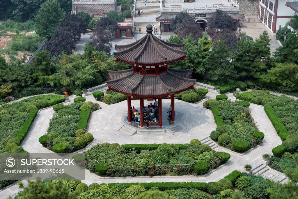 High angle view of people sitting under a pagoda; Xi'an, Shaanxi, China