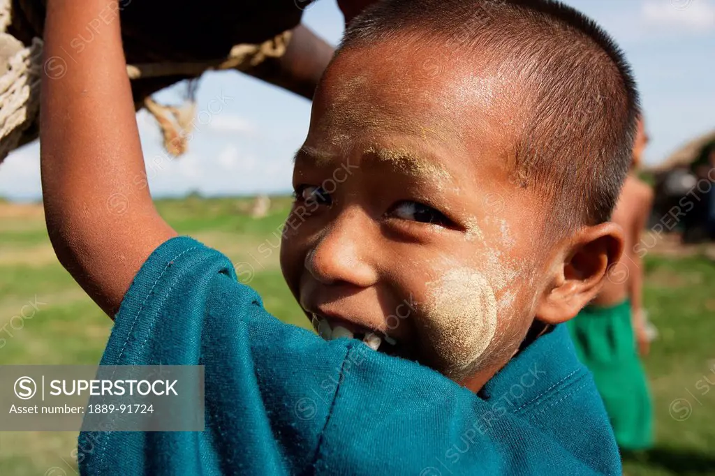 Boy Usng A Handpump To Collect Water In Myanmar; Ayeyarwady, Burma