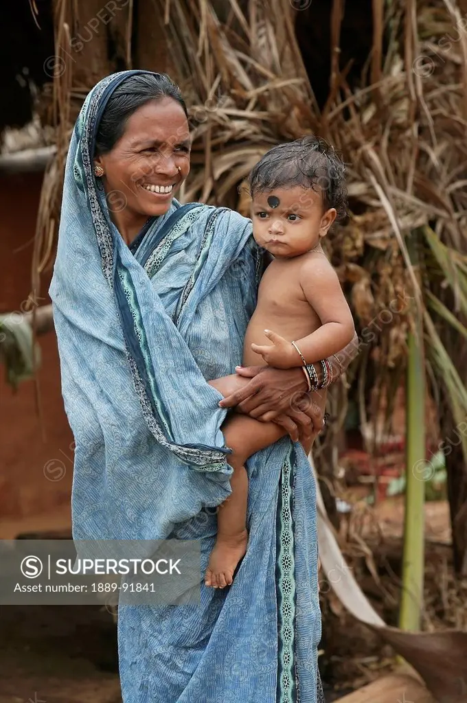 A mother and her son; Ratapata Village, Badamba, India
