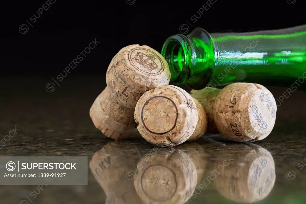 Three Corks And The Neck Of A Green Glass Bottle; Alberta, Canada