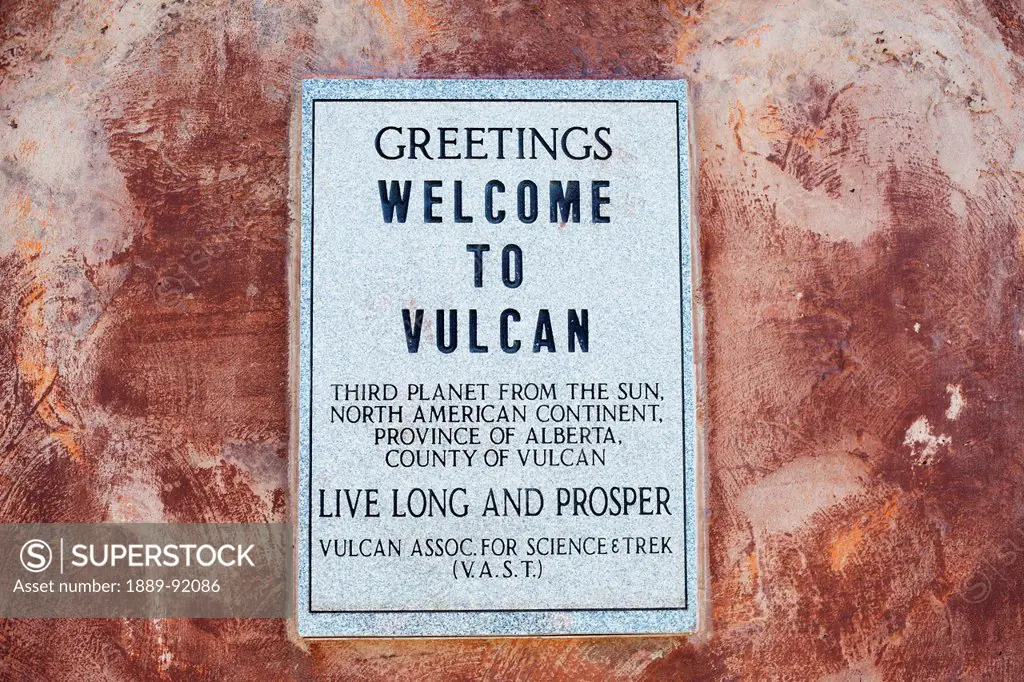 Sign On A Pedestal That Holds Vulcan's Starship Fx6-1995-A, Replica Of The Starship Enterprise From Gene Roddenberry's Star Trek; Vulcan, Alberta, Can...