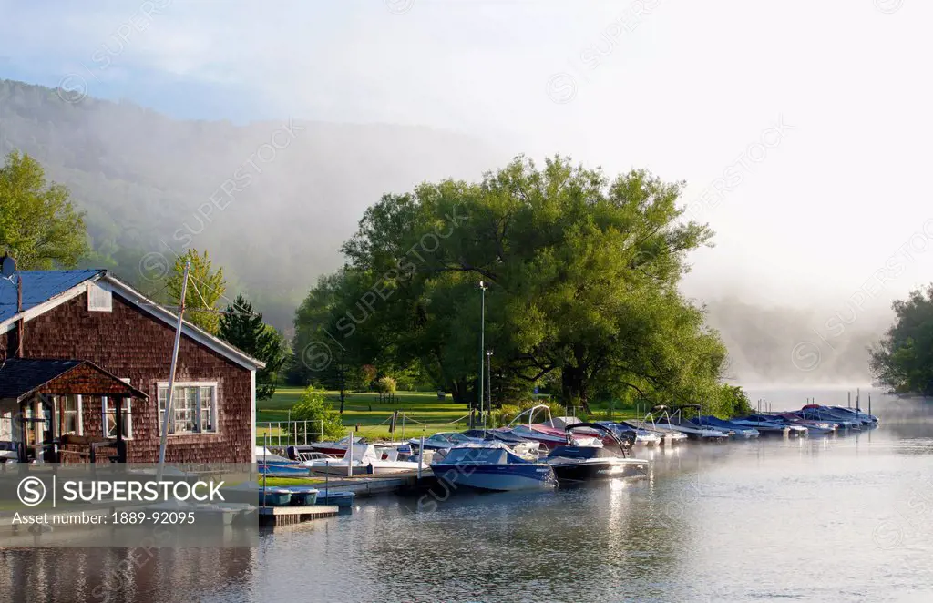 Boats In The Early Morning Mist; North Hatley, Quebec, Canada
