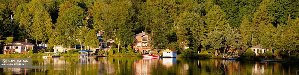 Cottages On Bowker Lake At Sunset; Quebec, Canada