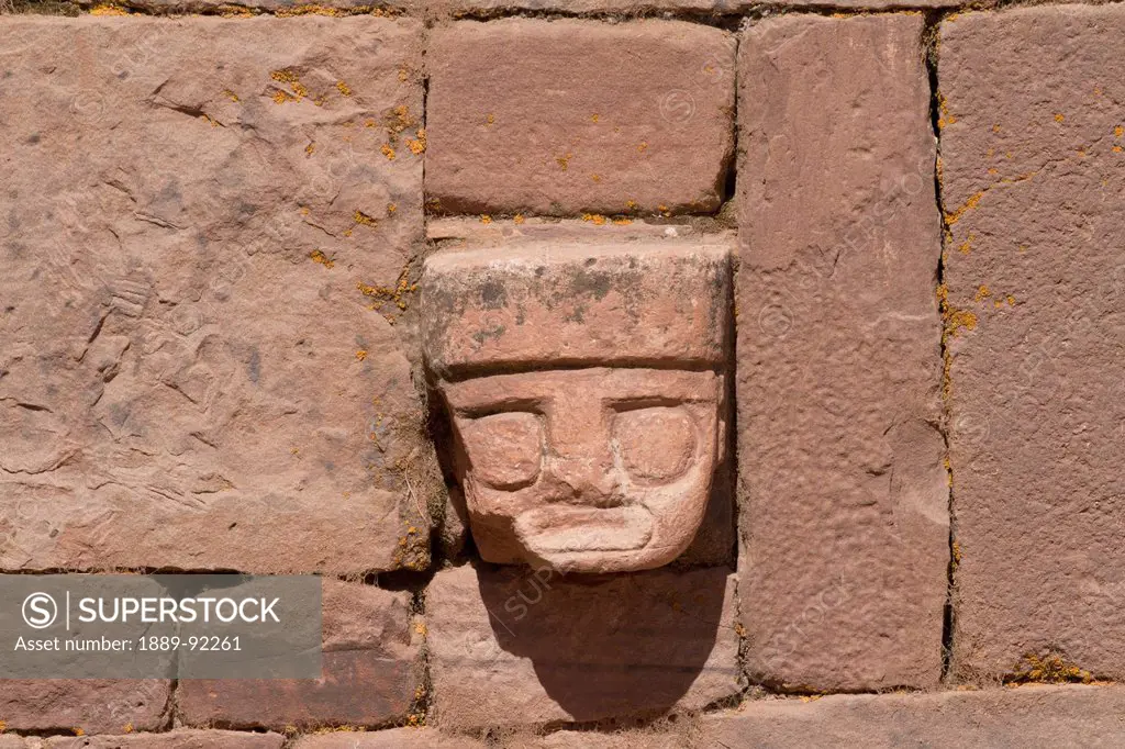 Carved stone tenon-head embedded in the wall of the Semi-subterranean Temple, Tiwanaku, La Paz Department, Bolivia