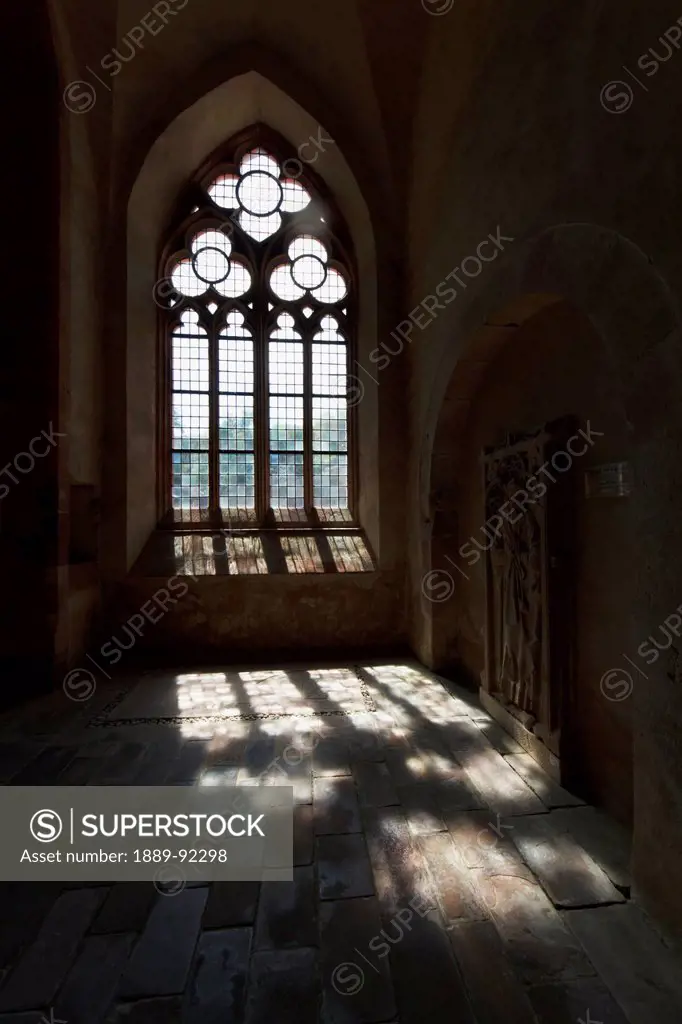 Wall grave slab and window of the basilica of Eberbach Abbey, Germany