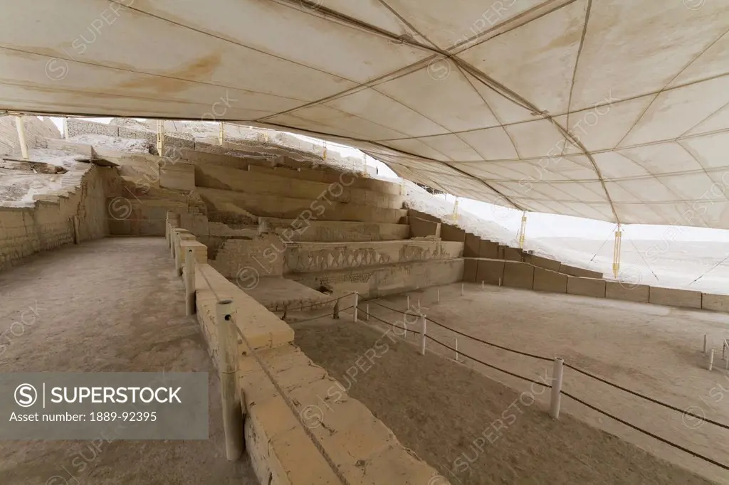 Walls of the Moche ceremonial precinct decorated with small high-relief iconographic designs containing approximately 50 iconographic figures in Huaca...