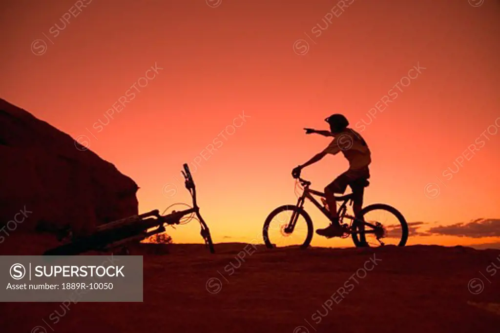 Person on bike pointing