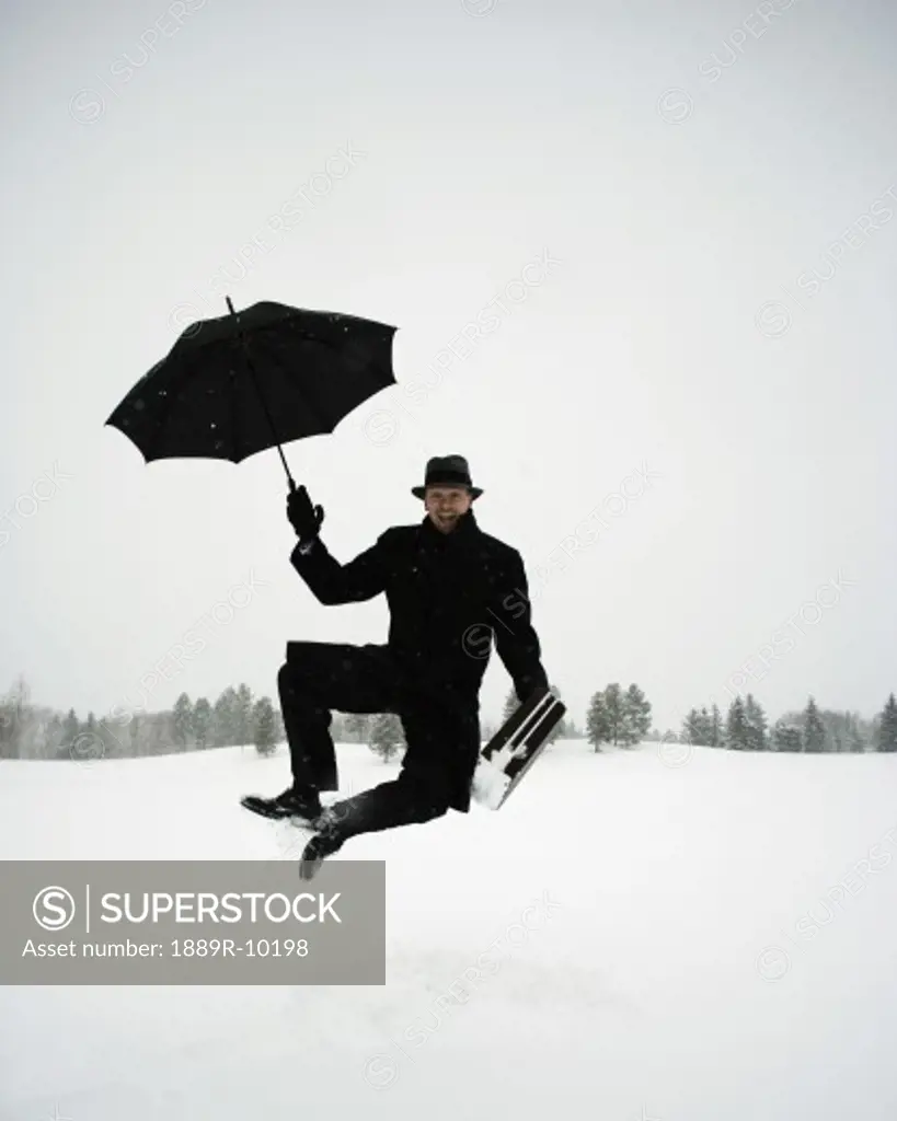 Carefree businessman in the snow