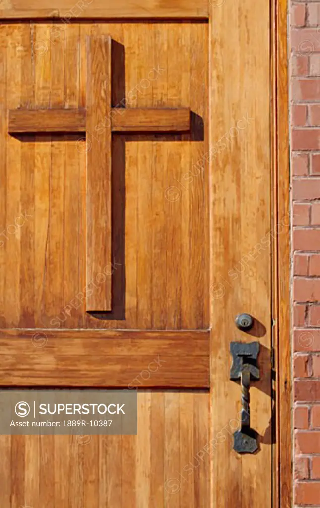 Cross on wooden door