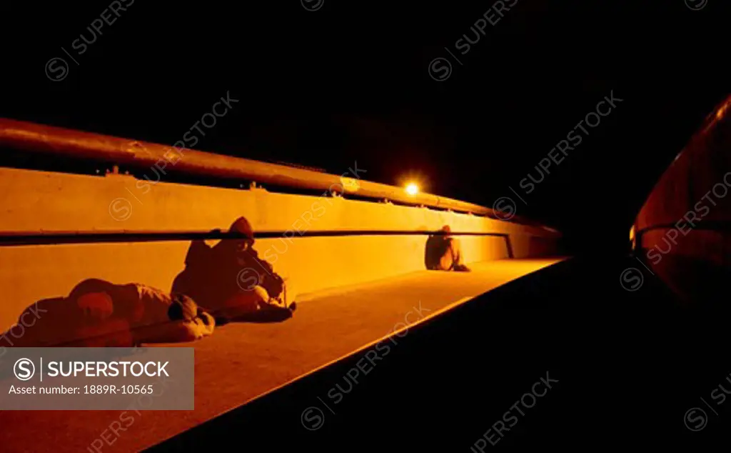 Homeless men on bridge