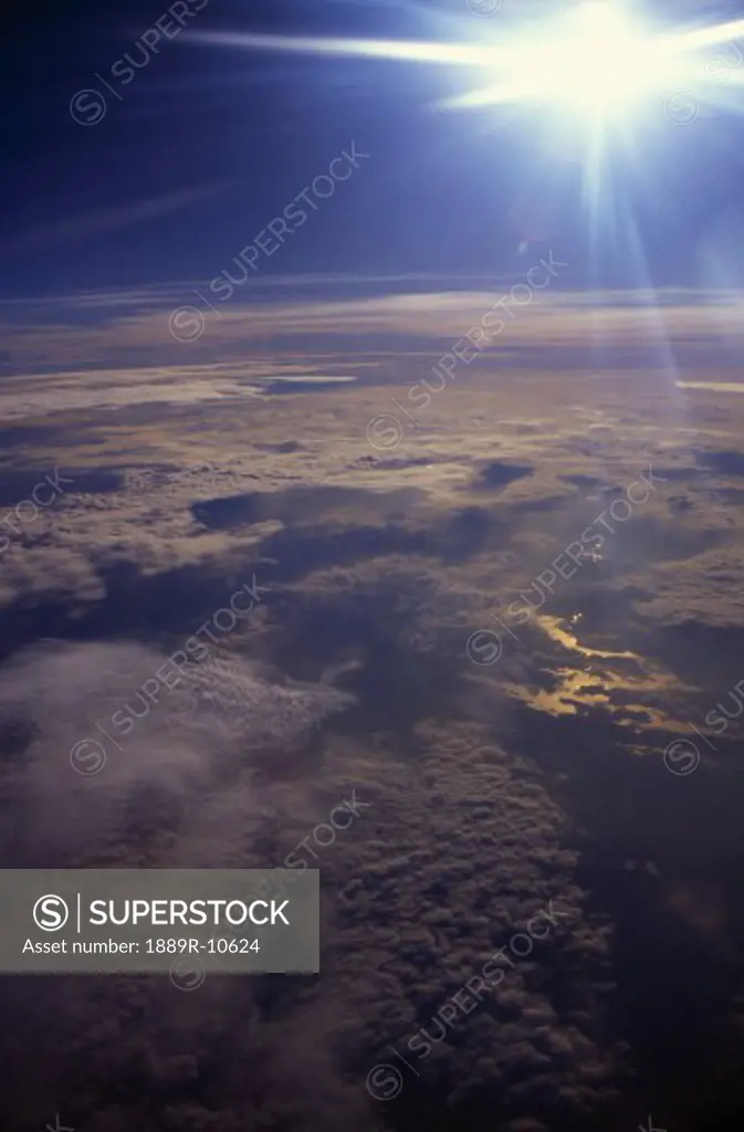 Aerial view of clouds and sunburst