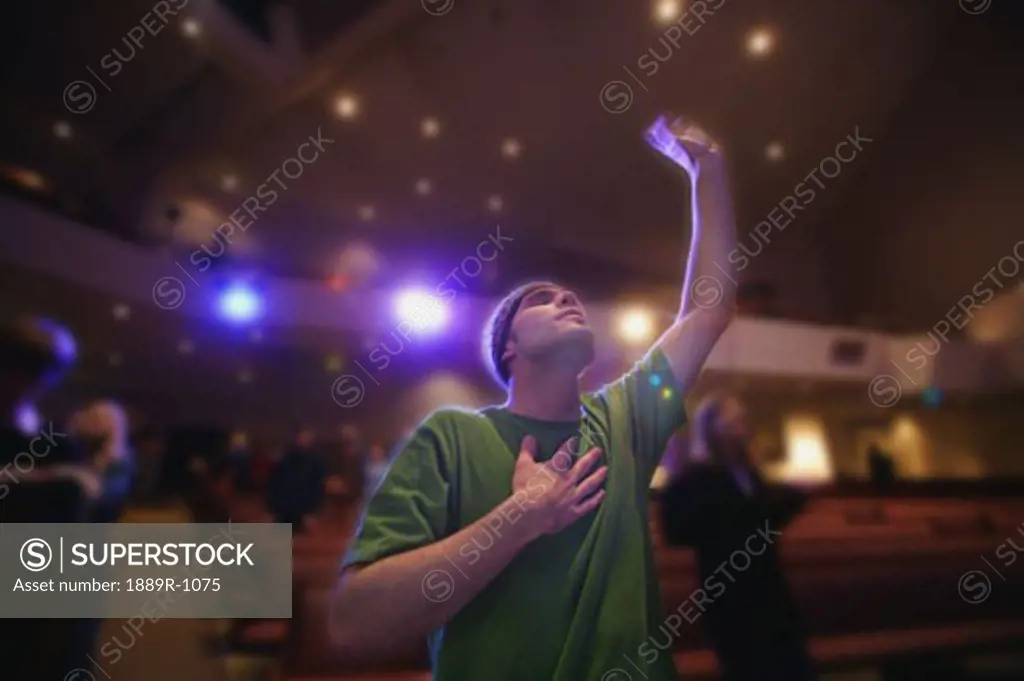 Man raising hand in worship