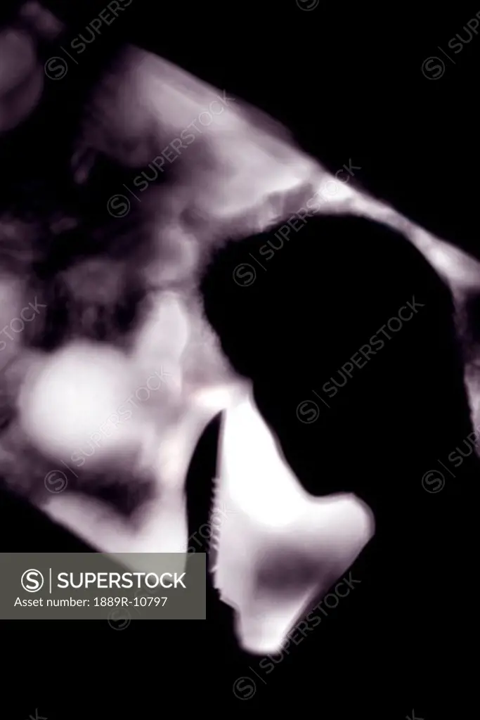 Silhouette of man holding knife