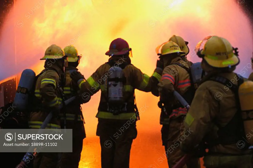 Firemen in front of fire