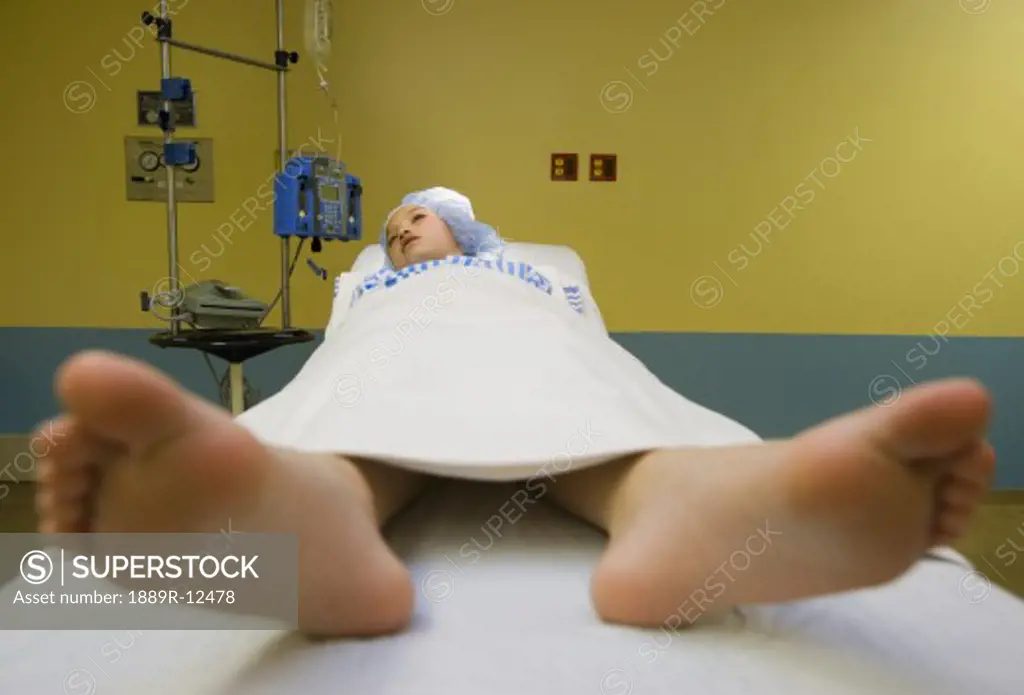Female patient lying on an operating table  