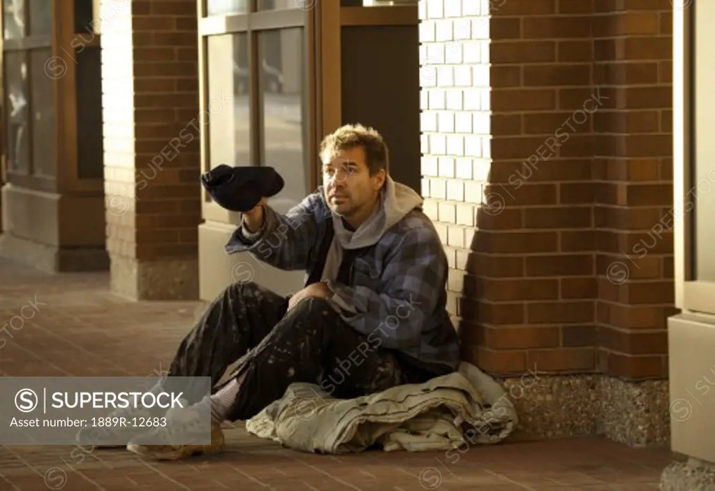 Homeless man begging for money