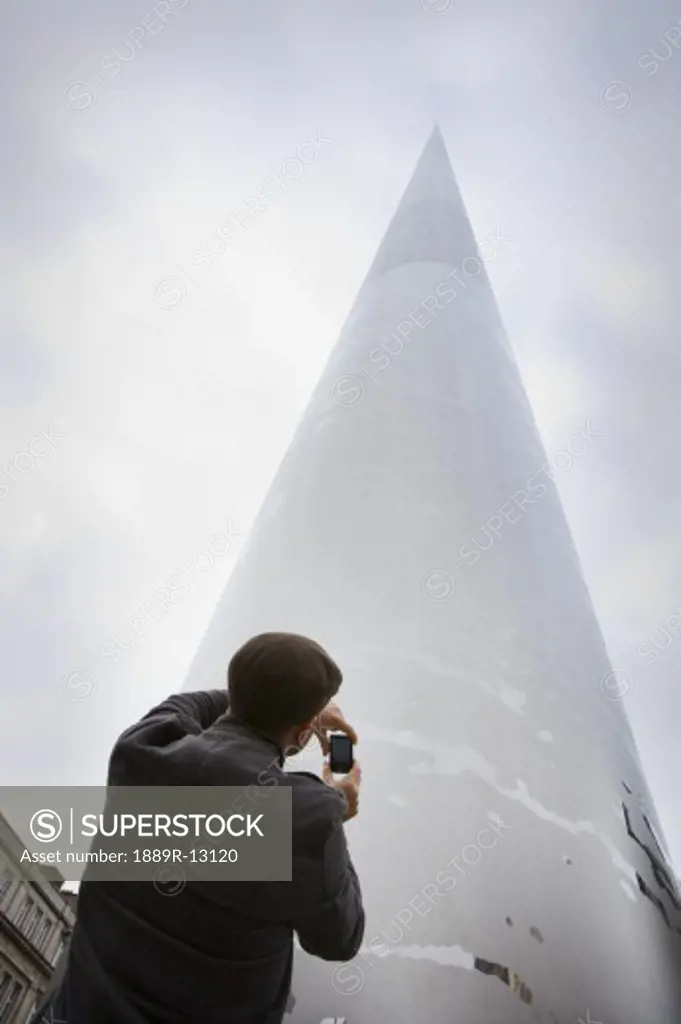 Tourist taking picture of the Spire of Dublin, Dublin, Ireland