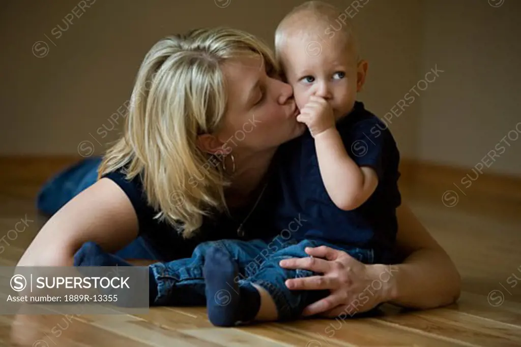 Mother kissing her son